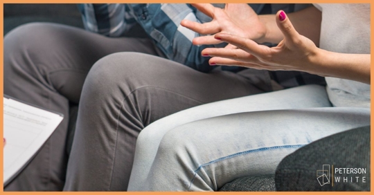 Hands of a parent upset with her co-parent